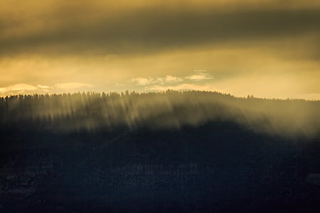 mountains under yellow sky thumbnail