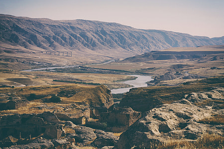 aerial photography of river between land and mountains thumbnail