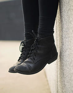 person sitting on gray concrete wall thumbnail