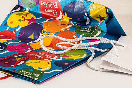 blue, yellow, and black gift bag thumbnail
