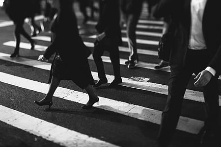 grayscale photo of people walking on pedestrian lane thumbnail