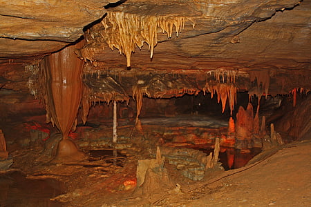 person taking photo of cave thumbnail