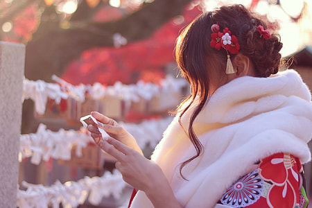 depth of field photography of woman in red and white floral dress thumbnail