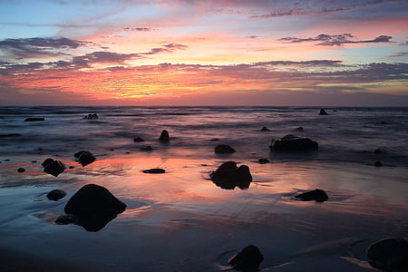body of water under cloudy sky thumbnail