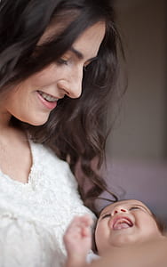woman carrying baby photo thumbnail