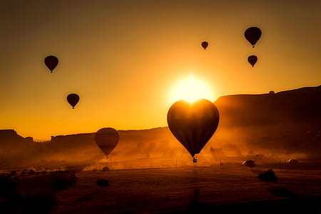 silhouette photo of hot air balloons thumbnail
