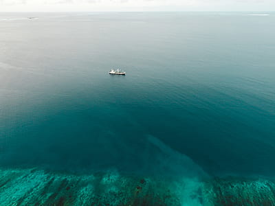 aerial photography of ship on sea thumbnail