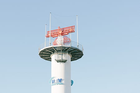 white and red tower close up photo at daytime thumbnail