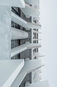 white concrete building under gray sky thumbnail