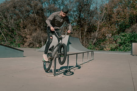 man riding bicycle doing tricks thumbnail