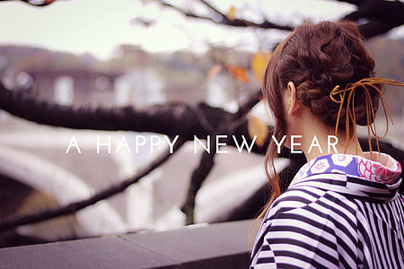 woman wearing back and white shirt with happy new year text thumbnail