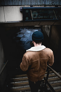 person walking on stair inside room thumbnail