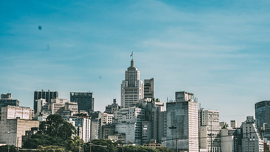 City Under Blue Cloudy Sky during Daytime thumbnail