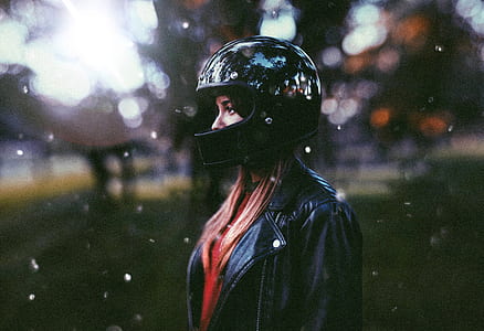 woman standing wearing black helmet during daytime thumbnail