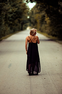 blonde haired woman in black spaghetti strap dress thumbnail