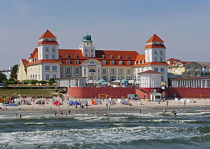 group of people gather on beach thumbnail