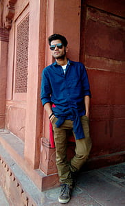 man leaning on wall thumbnail