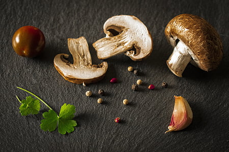 closeup photo of sliced mushrooms on gray surface thumbnail