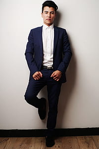 mn wearing blue notched-lapel blazer and dress pants thumbnail