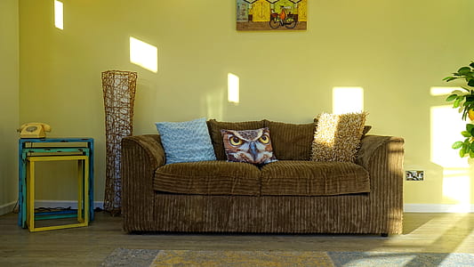 brown fabric 2-seat sofa near brown wicker decor thumbnail