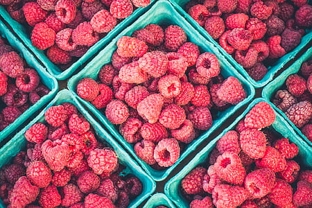 raspberries in plastic bowl lot thumbnail