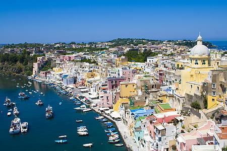 aerial photo of buildings near body of water at daytime thumbnail