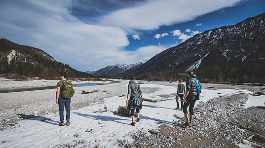 four person waling on mountain thumbnail