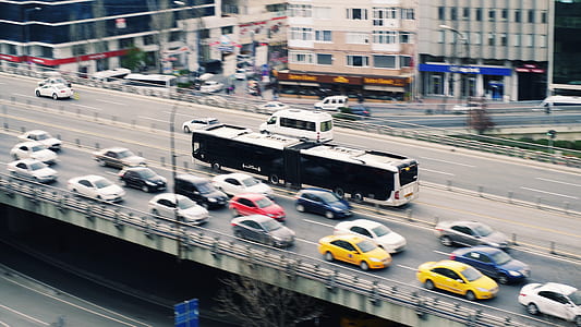 panning photography of vehicles on road thumbnail