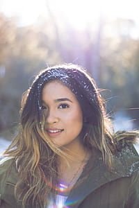 selective focus photography of woman with brown jacket thumbnail
