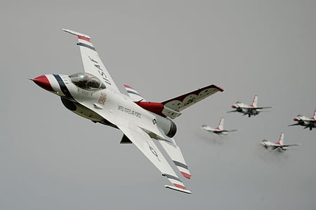 five fighter planes under grey sky at daytime thumbnail