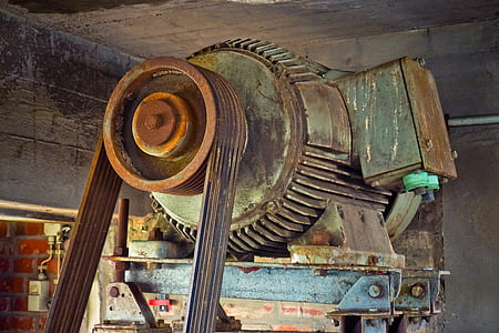 close-up photo of gray AC motor with timing belt thumbnail