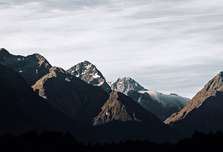 brown and gray mountains under white clouds thumbnail