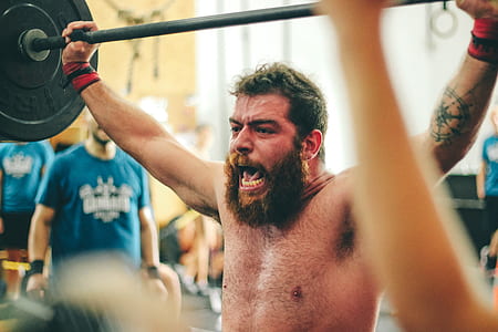 Man Carrying Black Barbell thumbnail