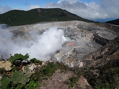 rock formation with smoke during daytime thumbnail