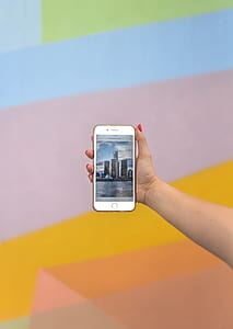 person holding turned on iPhone thumbnail