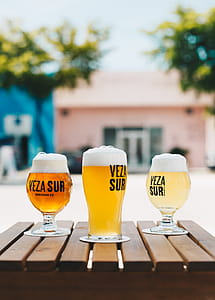 Three Veza Sur Glass Cup Filled With Beers thumbnail