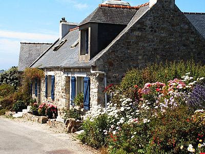 house surrounded by flowers thumbnail
