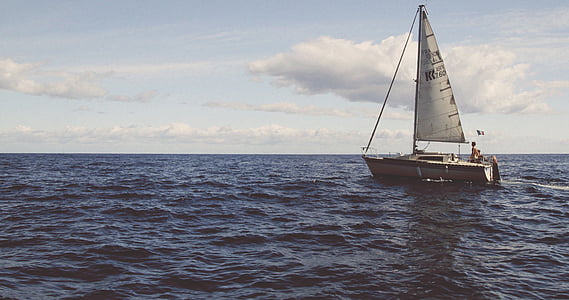 white sailboat on body of water during daytime thumbnail