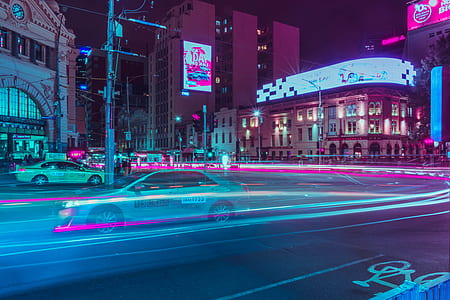 long exposure time lapse photography of sedan running on road during daytime thumbnail