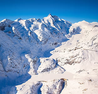 snow capped mountain under blue sky thumbnail