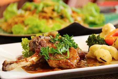 cooked meat with spinach on plate thumbnail