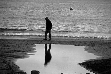 man walking on shore thumbnail