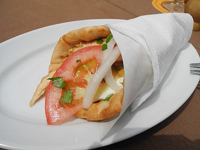 bread wrapped with tissue paper on plate thumbnail