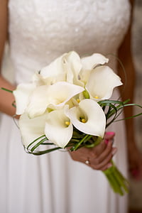 woman wearing gown holding lily bouquet thumbnail