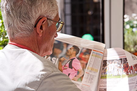 man reading newspaper thumbnail