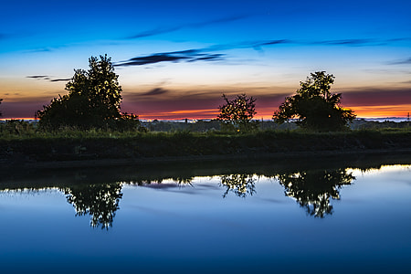 photo of green field near lake thumbnail
