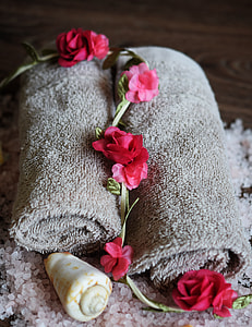 two gray fleece towels on brown surface thumbnail