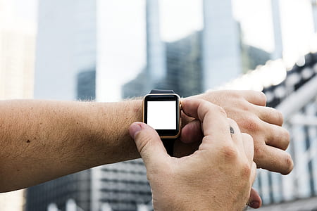 person turning on gold Apple Watch thumbnail