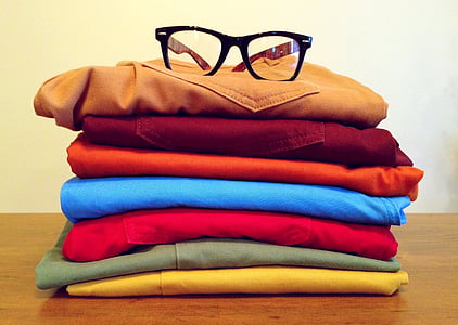 black-framed eyeglasses on top of brown bottoms thumbnail