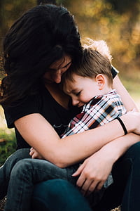 photo of woman hugging boy thumbnail